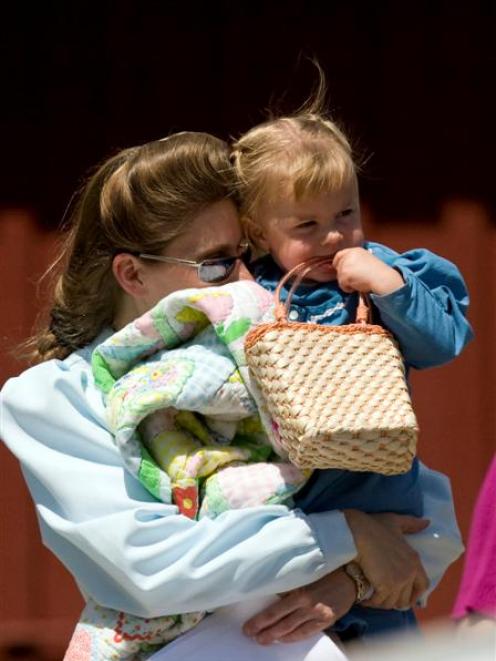 A woman from the Fundamentalist Church of Jesus Christ of Latter Day Saints leaves the Kidz...