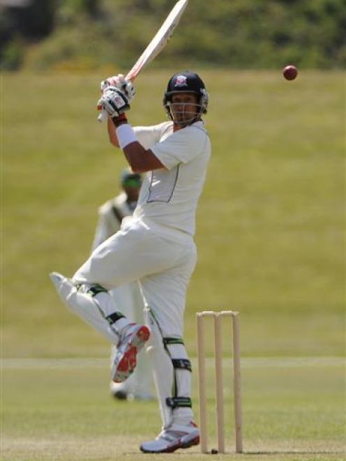 New Zealand Invitation XI batsman Daryl Tuffey plays a legside shot during his innings of  four runs