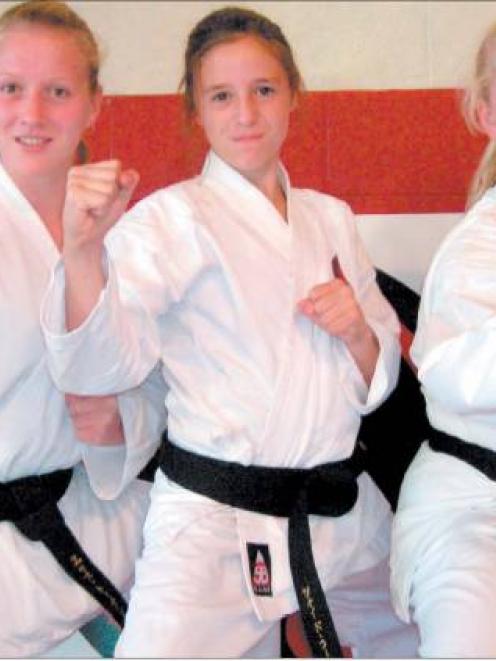 Don’t mess with me: West Otago Karate Club’s three new black belts are, from left, Cherise...