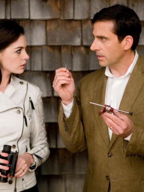 Maxwell Smart (Steve Carell) and Agent 99 (Anne Hathaway)check out a tricked-out Swiss Army Knife...