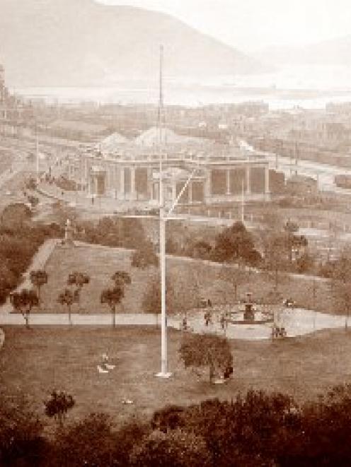 This panoramic view shows Queens Gardens in foreground, the Otago Early Settlers Association and...