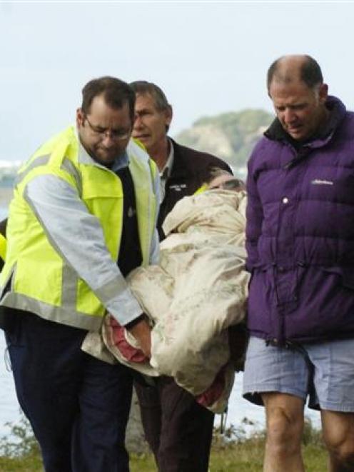 John Patterson, from Waitoa, is assisted by (from left) a St John ambulance officer, Helicopters...