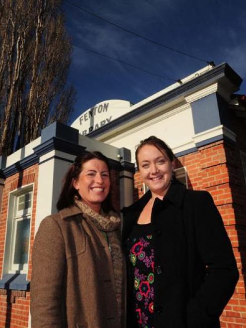 Amie Pont (left) hands over managerial responsibility for Burn 729am radio station to Melissa...