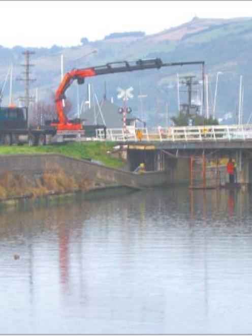 Full steam ahead: Dunedin train track work, such as the recent re-railing of the Leith Bridge...