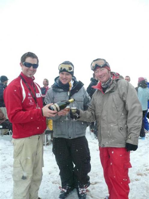 Ben Yoffa, of Queenstown pours some bubbly for Scott Maizey, of Christchurch, and Brent Harridge,...