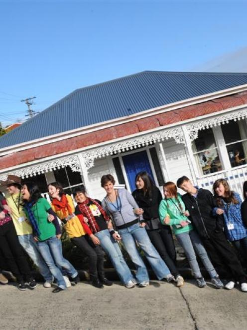 Teenagers from around New Zealand and Australia explore Baldwin St yesterday during a science...