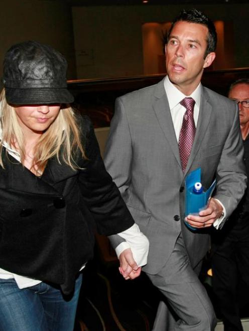 Sports presenter Tony Veitch and his wife Zoe Halford enter a news conference where he admitted...