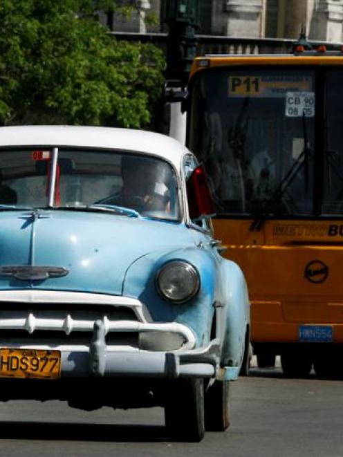 An American classic car used as a private taxi is seen in Havana. Transportation Minister Jorge...