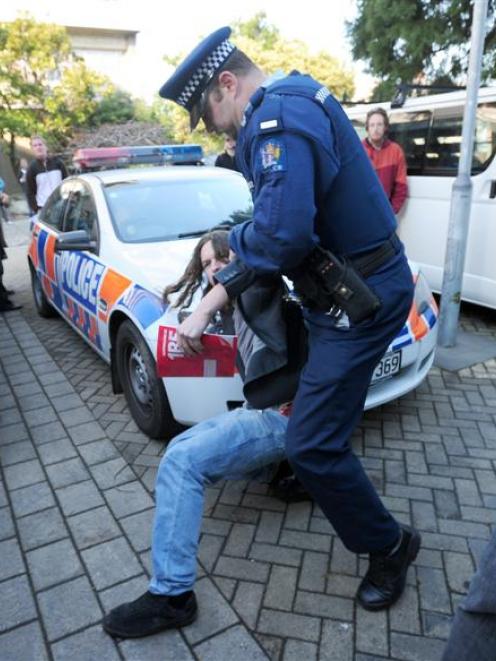 An 18-year-old student resists police.