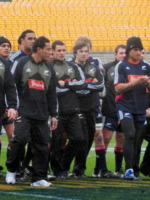 The All Blacks take part in the captain's run at Carisbrook yesterday. Photo by Craig Baxter.
