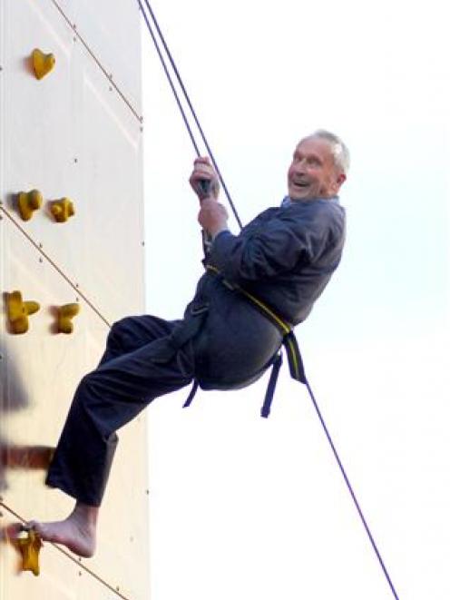 Retired Waitati man Graham Norrish (85) scales a 7.5m climbing wall in the Octagon, Dunedin,...