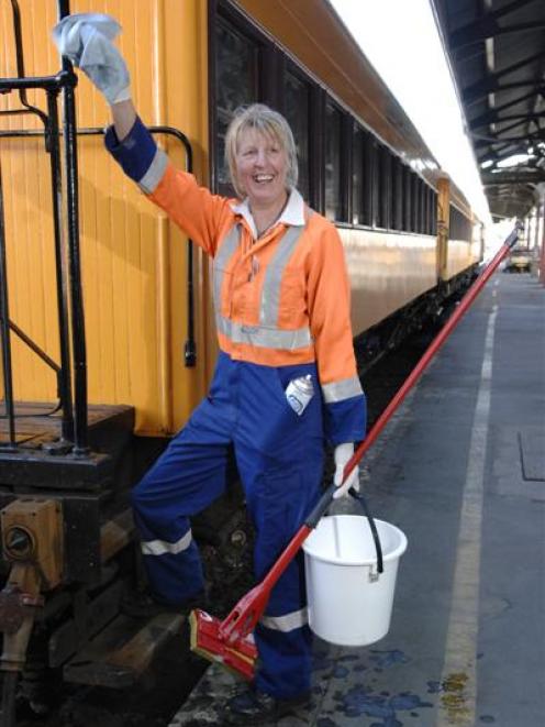 Taieri Gorge Railway assistant guard Judy Mann prepares carriages for today's "suburban rail...