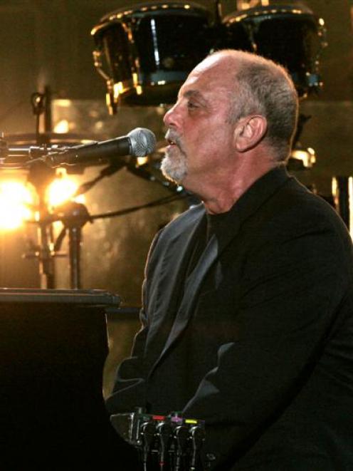 Billy Joel performs at Shea Stadium in New York. Photo Frank Franklin II/AP