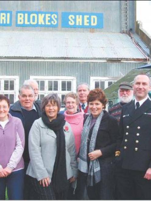 Sign of the times: Members of the Dunedin Blokes’ Shed steering committee and the interim...