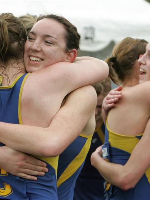 Otago shooter Greir Campbell embraces Hayley Saunders (left) and Jessica Tuki (far right) wraps...