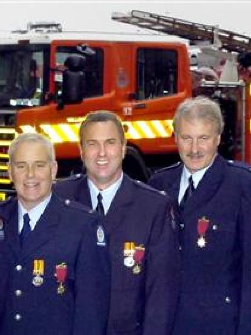 Dunedin firefighters, from left, John Griffiths, Richard Huuskes, Jock Mackay, Greg Casey, Murray...