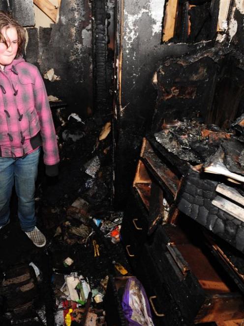 Andersons Bay School pupil Stephanie Pickles (10) visited a fire damaged house in Pine Hill on...