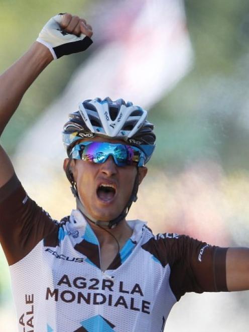 Alexis Vuillermoz crosses the finish line to win the 181.5km 8th stage of the Tour de France,...