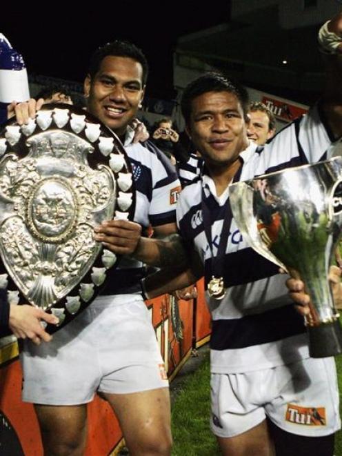 Auckland players Brad Mika (left) and Keven Mealamu celebrate with the Ranfurly Shield and Air...