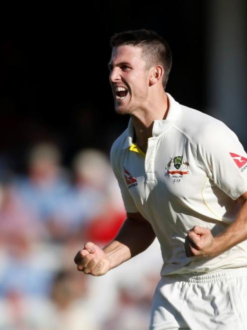 Australia's Mitchell Marsh celebrates the wicket of England's Ben Stokes. Action Images via...