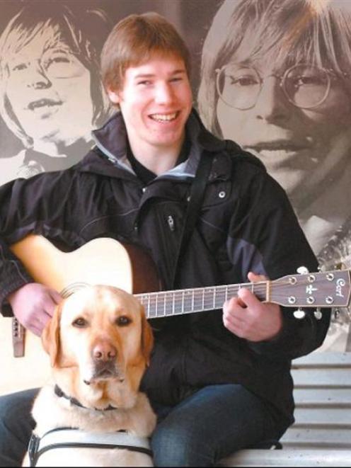 Bevan Gardiner, with guide dog Denim, gets ready for his lead role in the John Denver tribute...