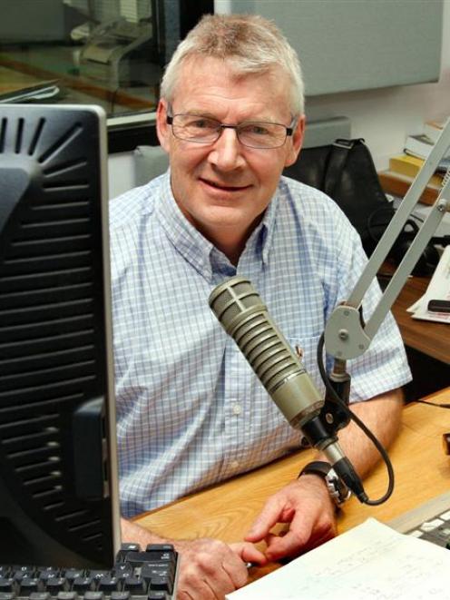 Brendan Telfer in his usual position at Radio Sport. Photo by the New Zealand Herald.