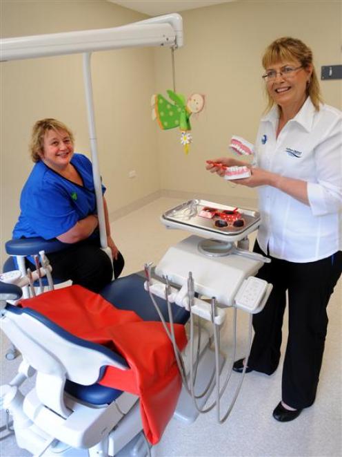 Dental therapist  and oral health promoter Robyn Hammond  (right) demonstrates tooth-brushing...