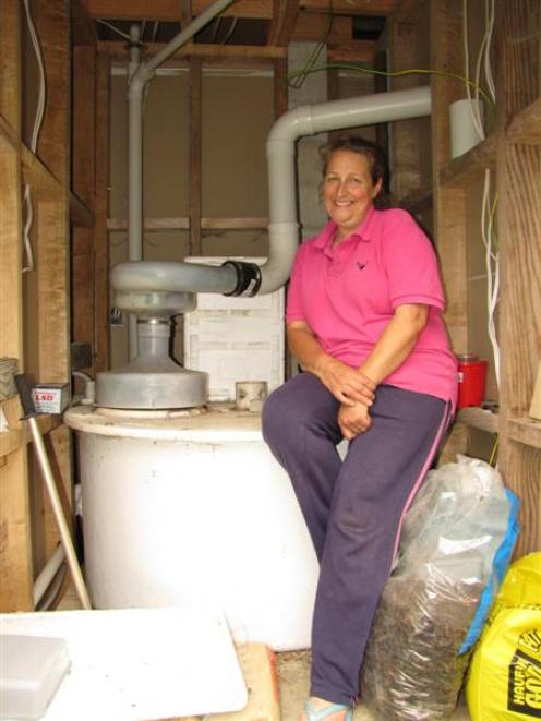 Dr Carol Hollebon, of Makarora, with the composting part of her family's toilet system. Photo by...