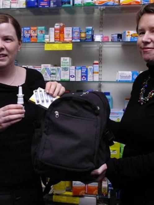 Dr Clare Strachan (left) and Professor Pauline Norris demonstrate dangerous medicine storage...
