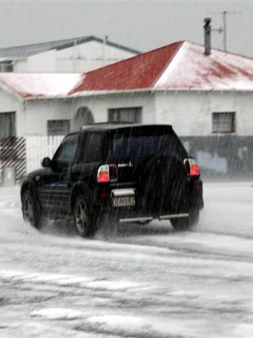 Invercargill summer . . . Hail covers the road in Invercargill during a storm that sent...