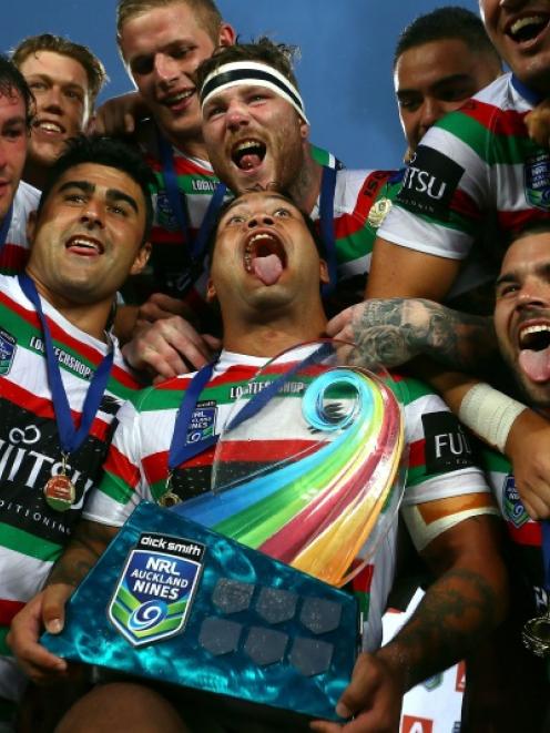 : Issac Luke of the Rabbitohs celebrates with the trophy following during the grand final match...