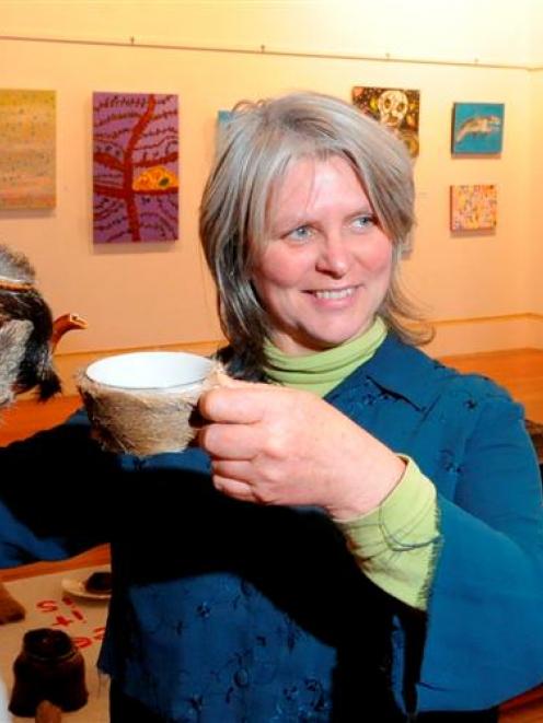 Judge Kim Pieters with a deerskin-covered tea set, Deer It Is, by Christchurch artist Tony...
