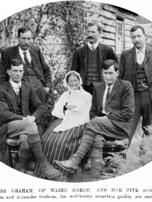 Mrs Graham, of Waiho Gorge, Westland, and her five sons. Flanking her are the well-known mountain...