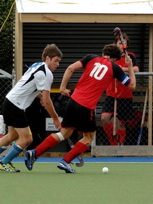 Northern player James Coughlan (left) and Canterbury skipper Tom Loudon jostle for possession as...