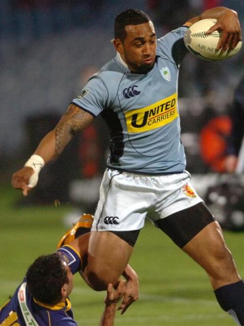 Northland winger Fetu'u Vainikolo runs through Otago first five-eighth Daniel Bowden to score a...