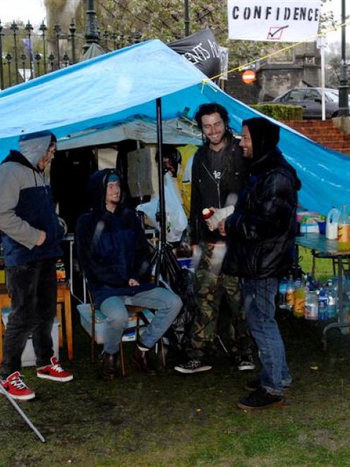 Sheltering in a makeshift camp kitchen in the Octagon are protesters (from left) Kane Bevins,...