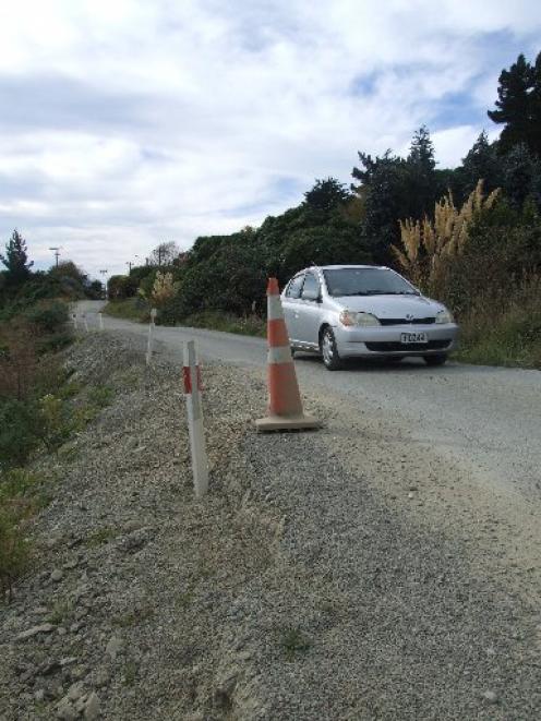 The "Haven St hole" at Moeraki illustrates the township's slip  problem.   Photo by Bill Campbell.