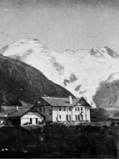The new Hermitage, a fine modern government hostelry, near the foot of Mt Cook. Mt Sefton and Mt...