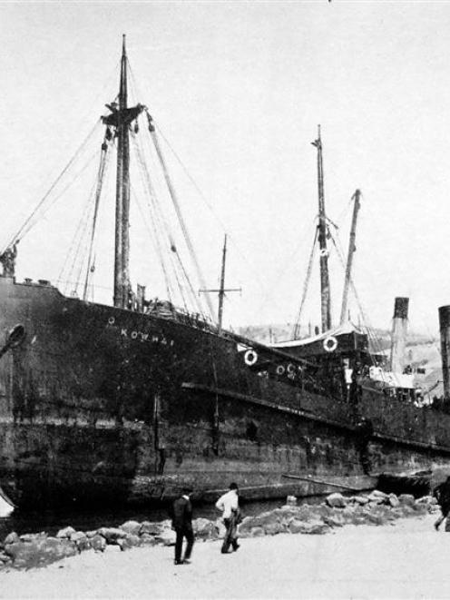 The Union Steam Ship Company's Kowhai, lying on the beach at the Spit, opposite Harington Point,...