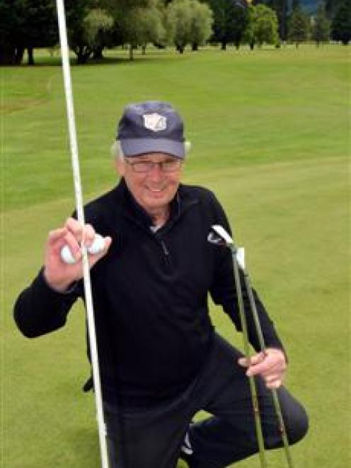 Twelve Oaks golfer Les Wilson celebrates his two holes in one in the past month. Photo by Gerard...