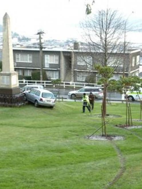 Tyre marks in the grass show the path of a Toyota Starlet after it left City Rd, Dunedin,...