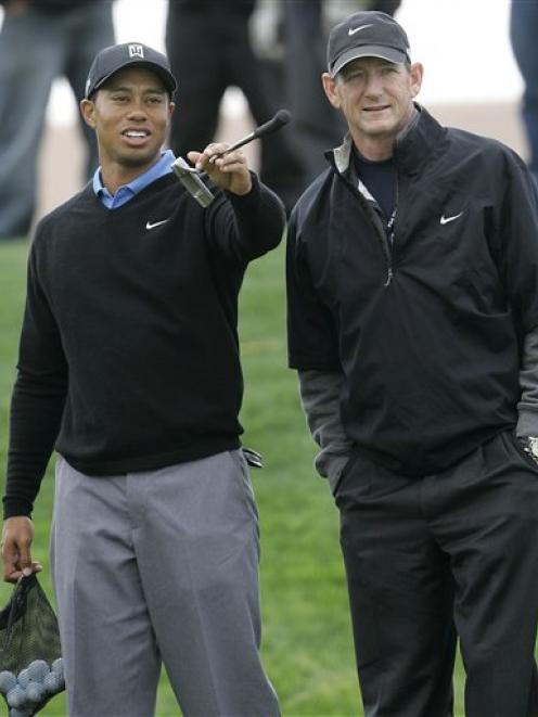 A 2007 file photo of Tiger Woods and coach Hank Haney.