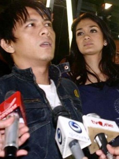 A 2009 AP file photo of pop singer Nazril Irham, better known as Ariel, left, and his girlfriend...