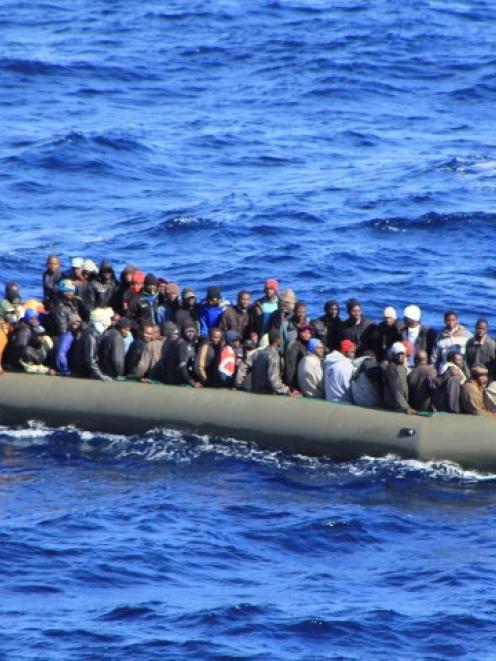 A boatload of migrants involved in the rescue operation. REUTERS/Marina Militare/Handout via Reuters