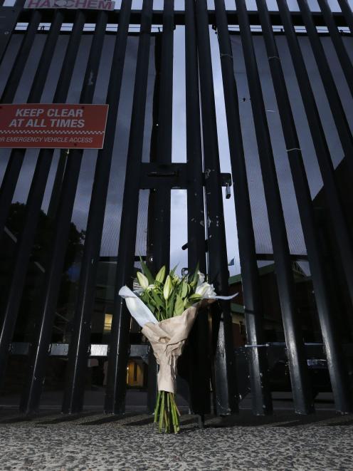 A bouquet left in memory of Australian cricketer Phillip Hughes is pictured at the gates of the...
