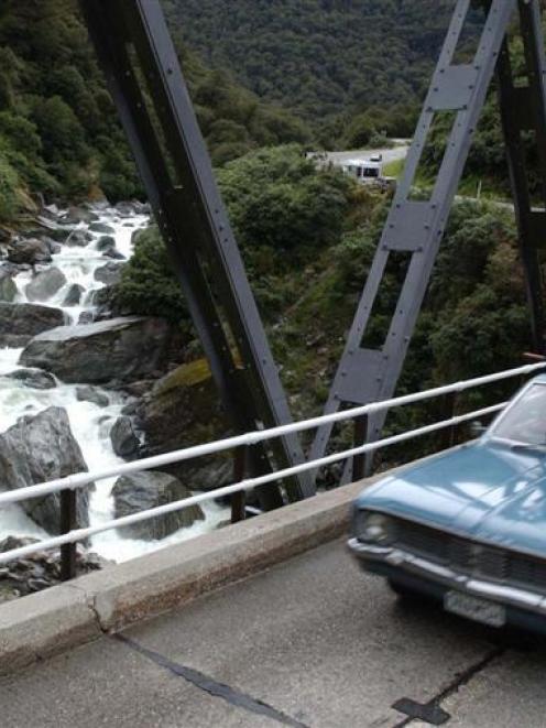 A car crosses the Gates of Haast bridge. Photo by Stephen Jaquiery.