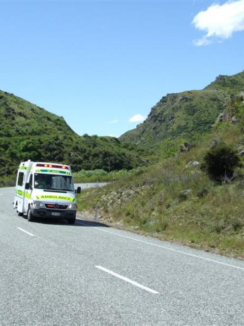 The car driver being transported to hospital after the double-fatality crash in the Lindis Pass....