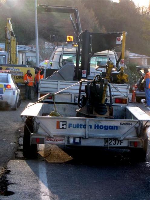 A car hit a truck and trailer on Frankton Rd yesterday morning. Photo by Joanne Carroll.