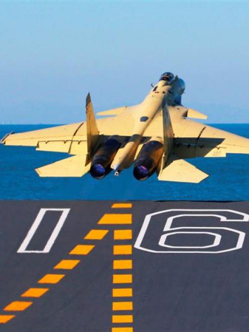 A carrier-borne J-15 fighter jet takes off from the Liaoning, China's first aircraft carrier....