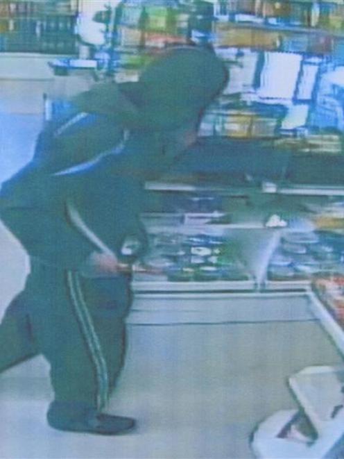 A CCTV image of a man suspected of carrying out an armed robbery at an Oamaru  dairy on Saturday....